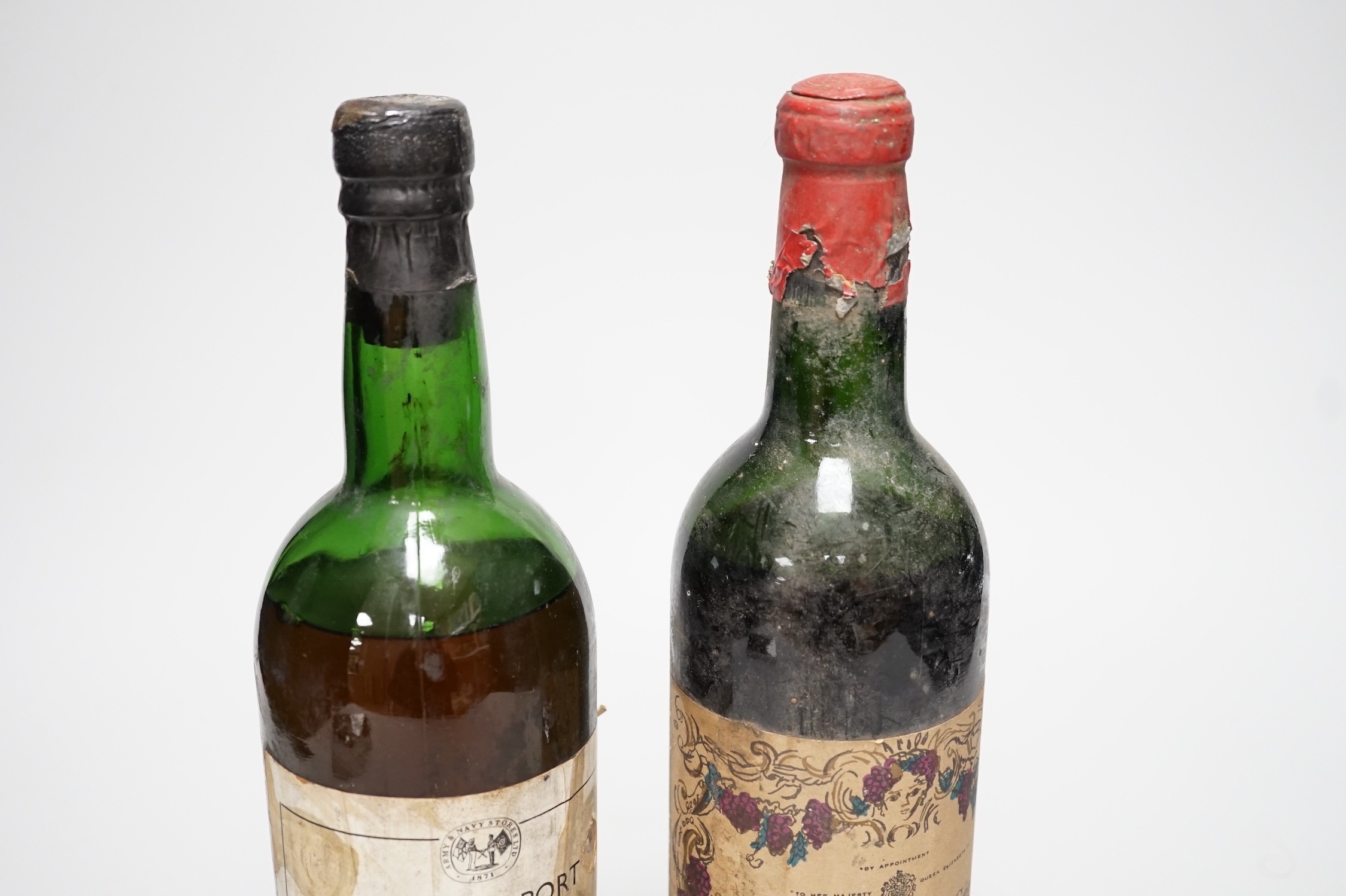 A bottle of Army and Navy stores 1960 vintage port and a bottle of Chateau Calon-Segur 1962